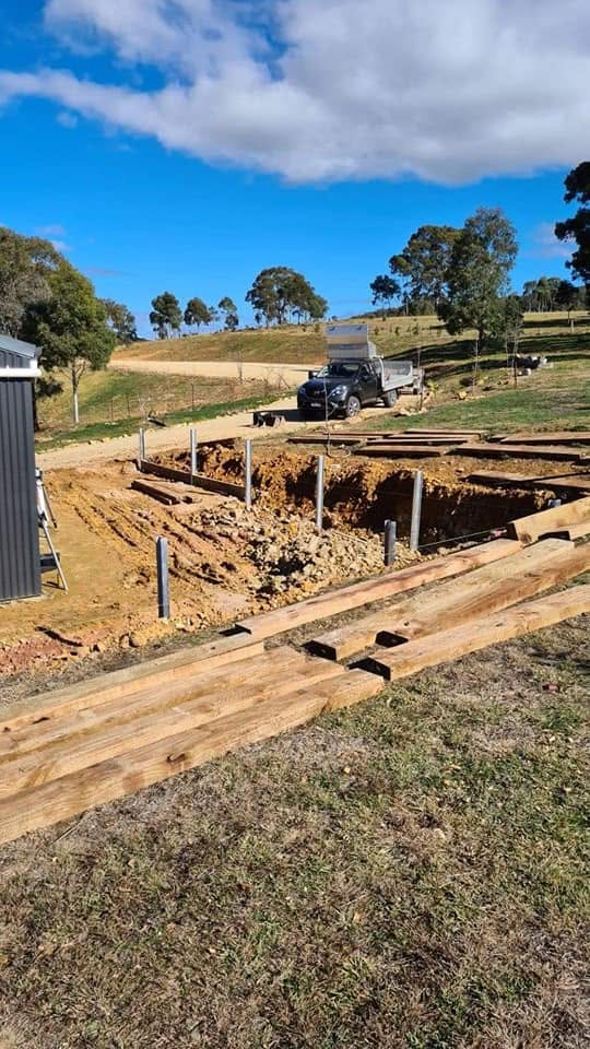 Excavation pit and truck at a rural property earthworks site
