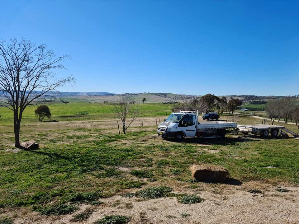 Markwicks Services truck and trailer parked in a rural paddock