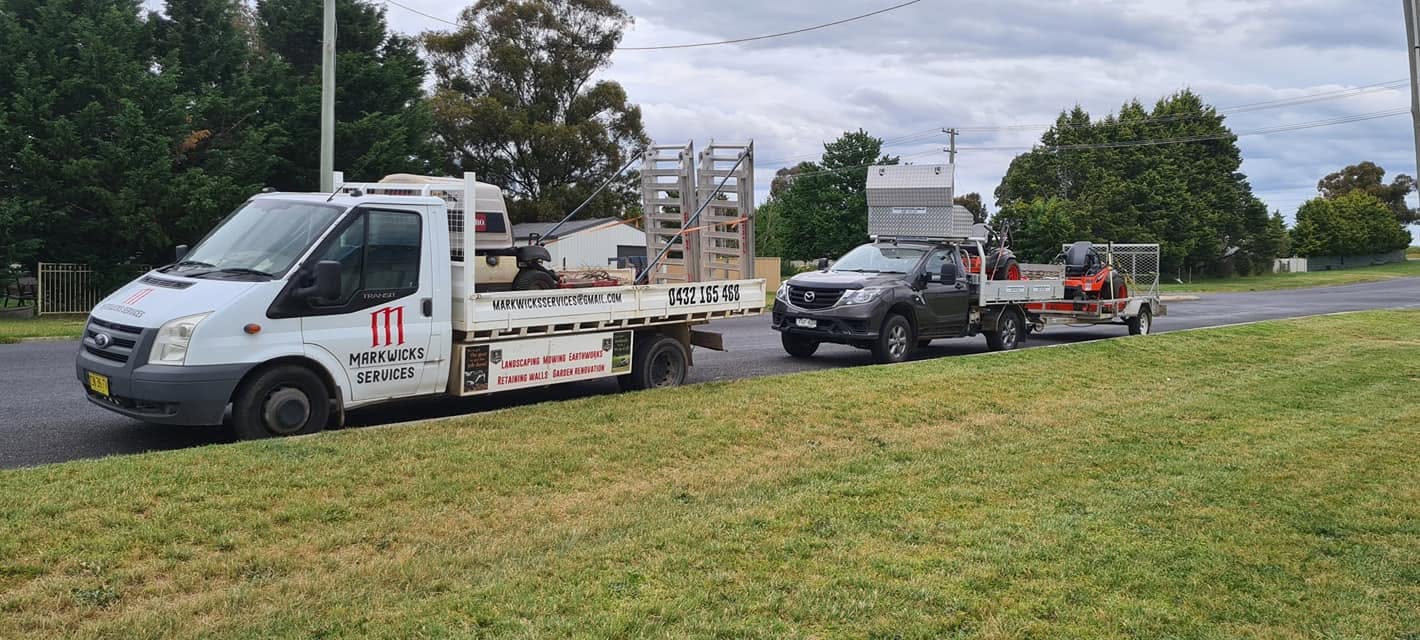 Markwicks Services truck, ute and trailer fleet parked together on a suburban street