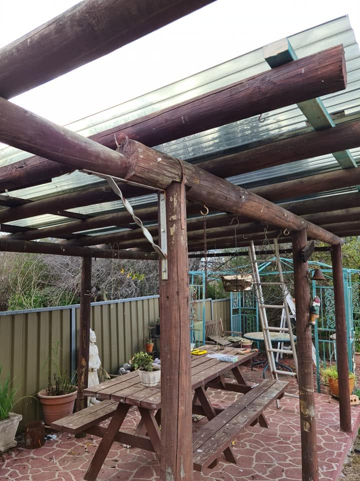 Markwicks Services crew member building a pergola roof